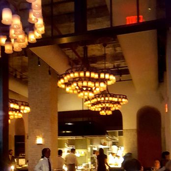 Le Coucou - Dining room with open kitchen in the rear - French Near Me - New York, New York