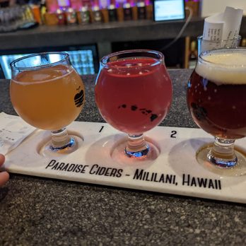 Paradise Ciders - Guava Lava (Paradise Ciders), Dragon Killah (Paradise Ciders), Red Zeppelin (Aloha Brewing) - Cideries Near Me - Mililani, Hawaii Paradise Ciders - Guava Lava (Paradise Ciders), Dragon Killah (Paradise Ciders), Red Zeppelin (Aloha Brewing) - Cideries Near Me - Mililani, Hawaii
