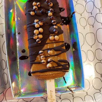 Popfancy Dessert Bar - Vietnamese coffee pop half dipped in dark chocolate with caramel crisps - Desserts Near Me - Houston, Texas Popfancy Dessert Bar - Vietnamese coffee pop half dipped in dark chocolate with caramel crisps - Desserts Near Me - Houston, Texas