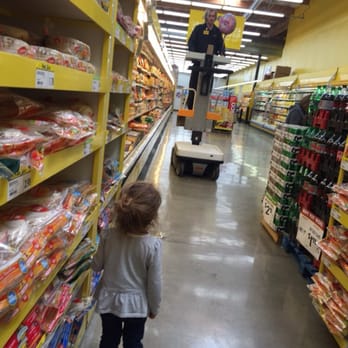 Food 4 Less - He went all the way to the top for her balloon!! Her Hero - Grocery Near Me - Atascadero, California