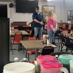 Southside Restaurant - Crystal receiving the plaque for the Veterans Day meal in 2023
