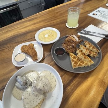 Southern Love - His chicken and waffles with side of cheesy grits. My biscuit and gravy with pork links and a side of fried fish. - Southern Near Me - Honolulu, Hawaii Southern Love - His chicken and waffles with side of cheesy grits. My biscuit and gravy with pork links and a side of fried fish. - Southern Near Me - Honolulu, Hawaii