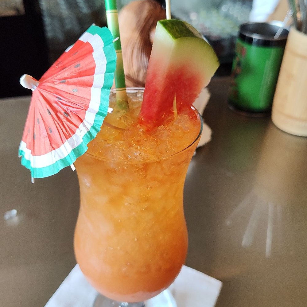 Bamboo Lounge - This is their rum punch, such amazing presentation and very tasty. - Cocktail Bars Near Me - Winston-Salem, North Carolina