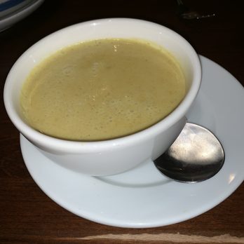 Thai Square - This is a side of yellow curry sauce, we got an extra rice plate to go with it. - Thai Near Me - Denton, Texas