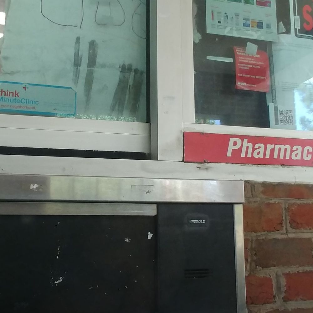 Pharmacy drive thru is closed. Cardboard sign. Pharmacy drive thru is closed. Cardboard sign.