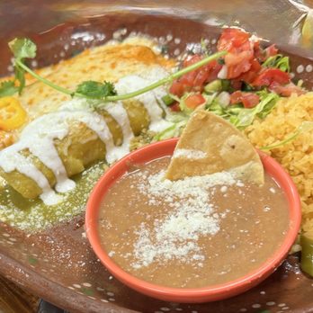 Dahlia's Mexican Grill - Combo plate with chicken enchilada with green sauce, chile relleno, rice & beans ~ delicious. - Breakfast & Brunch Near Me - Reno, Nevada