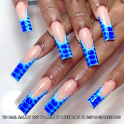 TD Nail Salon - Sophisticated with an edge--deep French tips meet alligator skin texture on long square nails.