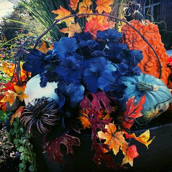 Eden Artistry - a decorative arrangement of fall leaves and pumpkins - Landscaping Near Me - Omaha, Nebraska