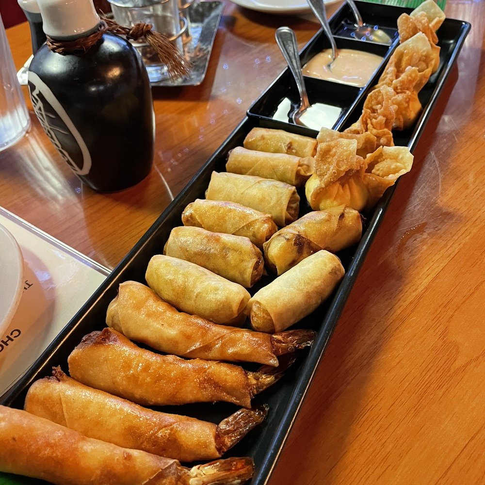 Noom Thai Bistro - App tray which in the shrimp roll, veggie role and crab rangoons. - Thai Near Me - Jacksonville, Florida Noom Thai Bistro - App tray which in the shrimp roll, veggie role and crab rangoons. - Thai Near Me - Jacksonville, Florida