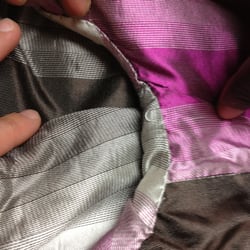 Wong's Custom Tailor - Closeup of poor stitching where sleeve meets coat body.