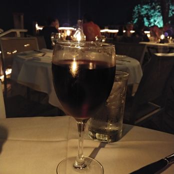 Louie's Backyard - Glass of Merlot. A very generous pour - New American Near Me - Key West, Florida