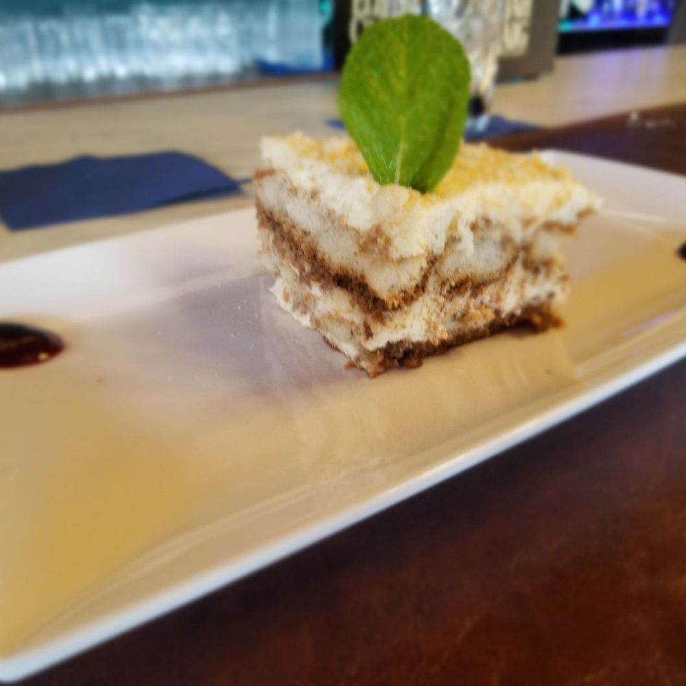 Tiramisu with very tasty raspberry sauce on the side.