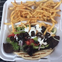 Table 286 - Lamb Gyro... with Tzatziki sauce,black olives, lettuce, tomatoes, onion,and green pepper.