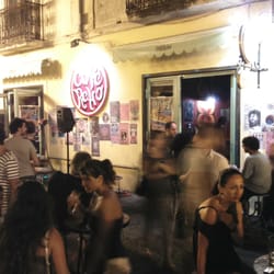 Cafè Retrò - View from the street. All people on the photo are bar visitors tbat are holding their drinks and eatching the life musician.