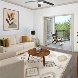 Camden Town Square Apartments - Living room with balcony in apartment home at Camden Town Square in Kissimmee Florida