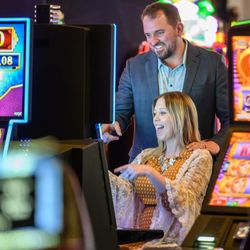 Turtle Creek Casino & Hotel - Customers at slot machine