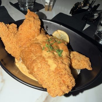 Kitchen + Kocktails By Kevin Kelley - Fried Mississippi catfish with grits - Southern Near Me - Miami, Florida Kitchen + Kocktails By Kevin Kelley - Fried Mississippi catfish with grits - Southern Near Me - Miami, Florida