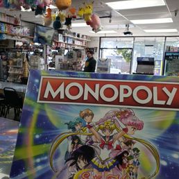closeup of sailor moon monopoly and the store, entrance side, in the background. closeup of sailor moon monopoly and the store, entrance side, in the background.