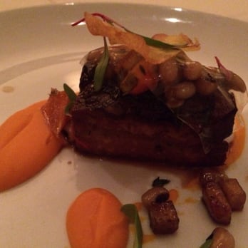 Nine-Ten - Jamaican Jerk Pork Belly Appetizer with Swiss chard, black-eyed peas, and sweet potato purée - Bars Near Me - La Jolla, California