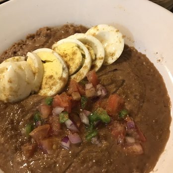 Habesha Cafe - Foul (ful) usually eaten at breakfast. It is fava beans akin to refried pinto beans with a salsa like condiment on top. - Ethiopian Near Me - Seattle, Washington