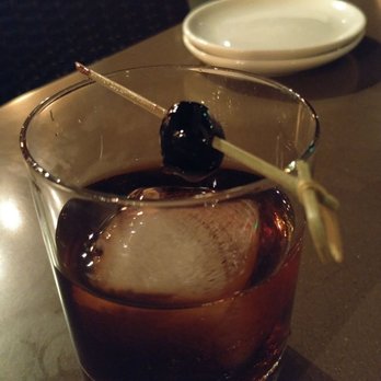 Eureka! - Smokey cold brew old fashioned. A great non-alcoholic cocktail for people who enjoy the complex flavor of a whiskey - American Near Me - Indian Wells, California Eureka! - Smokey cold brew old fashioned. A great non-alcoholic cocktail for people who enjoy the complex flavor of a whiskey - American Near Me - Indian Wells, California