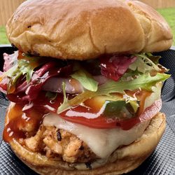 Oceans89 - Salmon burger. Salmon patty meat on a brioche bun topped with your choice of available toppings.