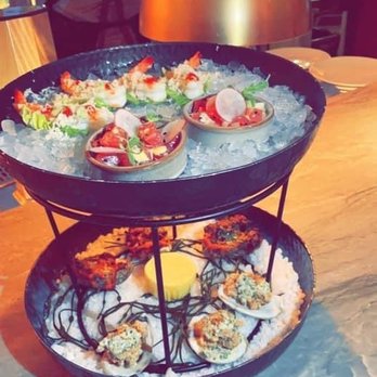 Bludorn - Petite tower - Tuna Tartar, shrimp cocktail and we chose 1/2 fried and 1/2 roasted oysters. - New American Near Me - Houston, Texas