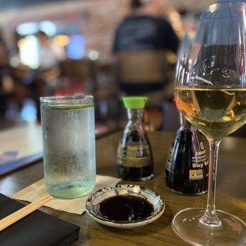 Blue Sushi Sake Grill - a glass of wine and a plate of sushi - Sushi Bars Near Me - Omaha, Nebraska