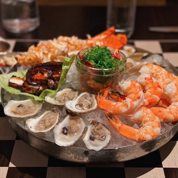 The Committee Chophouse - Large seafood platter with oysters, jumbo shrimp, lobster salad, half lobster tail, smoked clams, and chef's choice of sous vide octopus. - Cocktail Bars Near Me - Omaha, Nebraska The Committee Chophouse - Large seafood platter with oysters, jumbo shrimp, lobster salad, half lobster tail, smoked clams, and chef's choice of sous vide octopus. - Cocktail Bars Near Me - Omaha, Nebraska