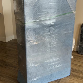 Meticulous Moverz - Glass piece padded/ shrink wrapped with light blue "fragile" side to let the team know to be easier with this specific piece. - Packing Services Near Me Meticulous Moverz - Glass piece padded/ shrink wrapped with light blue "fragile" side to let the team know to be easier with this specific piece. - Packing Services Near Me