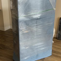 Meticulous Moverz - Glass piece padded/ shrink wrapped with light blue "fragile" side to let the team know to be easier with this specific piece.