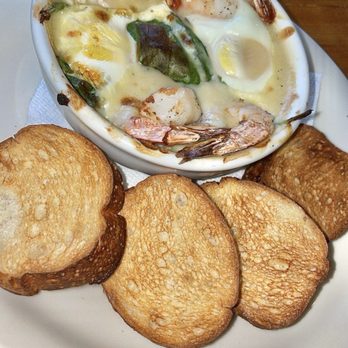 Cream Pot - Baked Eggs - Two soft baked eggs & toasted baguettes, tiger shrimp, spinach, caramelized onions, with béchamel sauce $29.50 - Breakfast & Brunch Near Me - Honolulu, Hawaii Cream Pot - Baked Eggs - Two soft baked eggs & toasted baguettes, tiger shrimp, spinach, caramelized onions, with béchamel sauce $29.50 - Breakfast & Brunch Near Me - Honolulu, Hawaii