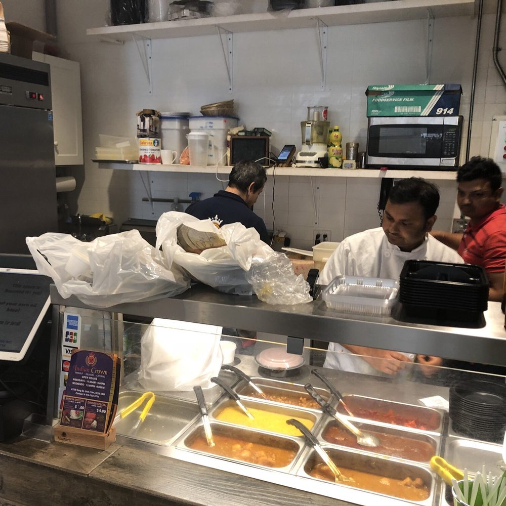 a man and a woman working in a restaurant kitchen a man and a woman working in a restaurant kitchen