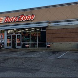 Autozone - view of front of building (parking lot is filthy with spills of vehicle fluids)
