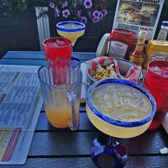 Roots Burger Bar - Our patio table with margarita pitcher - American Near Me - Carmel, Indiana Roots Burger Bar - Our patio table with margarita pitcher - American Near Me - Carmel, Indiana