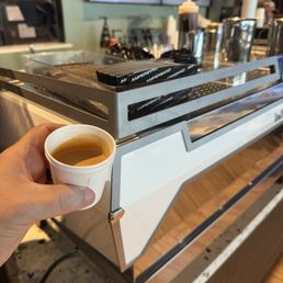 Lovely espresso next to the big La Marzocco