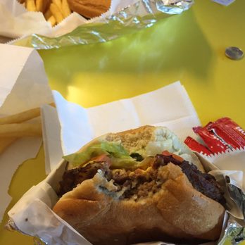 Mojo's - a sandwich and french fries on a table - Barbeque Near Me - North Little Rock, Arkansas Mojo's - a sandwich and french fries on a table - Barbeque Near Me - North Little Rock, Arkansas