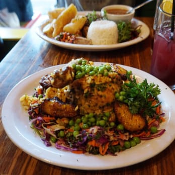 Pambiche - Arroz con pollo and Plato Cubano behind it - Cuban Near Me - Portland, Oregon