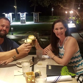 Monkeypod Kitchen - Monkeypod Mai Tai. Table overlooking the beach, ocean and Maui life - New American Near Me - Lahaina, Hawaii Monkeypod Kitchen - Monkeypod Mai Tai. Table overlooking the beach, ocean and Maui life - New American Near Me - Lahaina, Hawaii