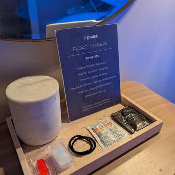 Pause Newport Beach - Items to help with the float and qtips in the jar along with a list of float benefits - IV Hydration Near Me - Newport Beach, California