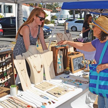The Market at North Beach - a woman buying jewelry - Farmers Market Near Me - San Clemente, California The Market at North Beach - a woman buying jewelry - Farmers Market Near Me - San Clemente, California