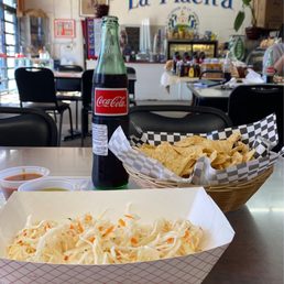While you wait for the homemade pupusas you will get a basket of chips, Salvadoran slaw and some hot sauces While you wait for the homemade pupusas you will get a basket of chips, Salvadoran slaw and some hot sauces