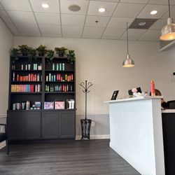 Shear Genius Hair Salon - Check in & product wall