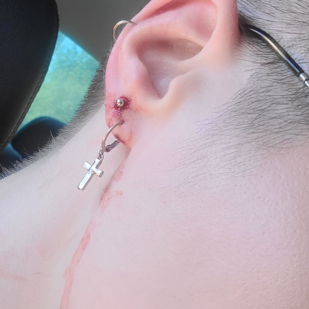 Lobe piercing went through cartilage, left shop actively bleeding with paper towel on my face for the mess.