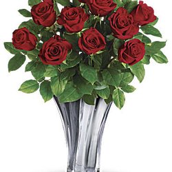 Alberta's Flowers - Romantic arrangement features 12 red roses and lemon leaf.