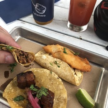 Bartaco - Roasted duck taco and baja fish taco (ribeye in my hand, I believe) - Tacos Near Me - Aventura, Florida Bartaco - Roasted duck taco and baja fish taco (ribeye in my hand, I believe) - Tacos Near Me - Aventura, Florida
