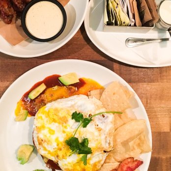 Moxies - Honey garlic wings and Huevos Rancheros (switched to egg over easy instead of sunny side up) with an added side of bacon. - Canadian (New) Near Me - Toronto, Ontario