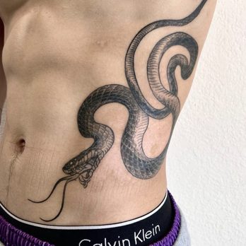The Skull Serpent Dagger - Snake rib tattoo - Tattoo Near Me