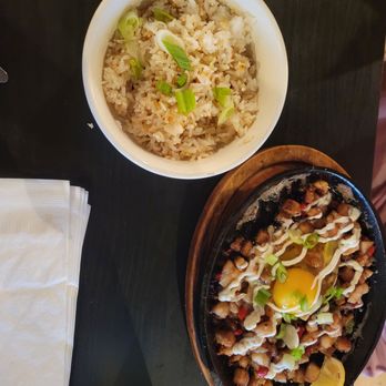 Tita Flora's - Sisig - Sizzling pork, chili pepper, onion, and mayo Served on hot plate with egg and citrus - very spicy and delicious - Breakfast & Brunch Near Me - Independence, Ohio Tita Flora's - Sisig - Sizzling pork, chili pepper, onion, and mayo Served on hot plate with egg and citrus - very spicy and delicious - Breakfast & Brunch Near Me - Independence, Ohio
