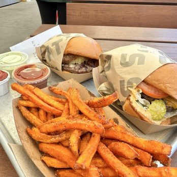 Gott's - Regular cheeseburger, Gruyère and caramelized onion burger and sweet potato fries. - Burgers Near Me - Los Angeles, California